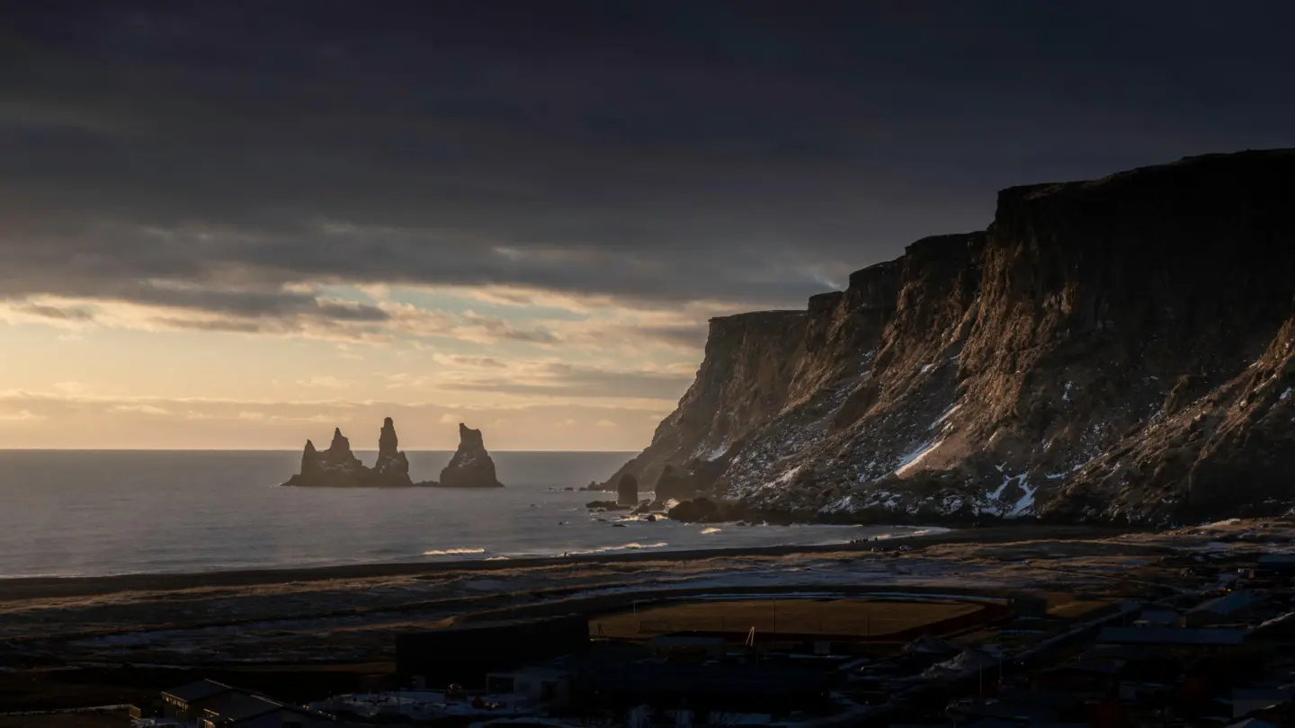 Mountains and sea pillars photographed at sunset